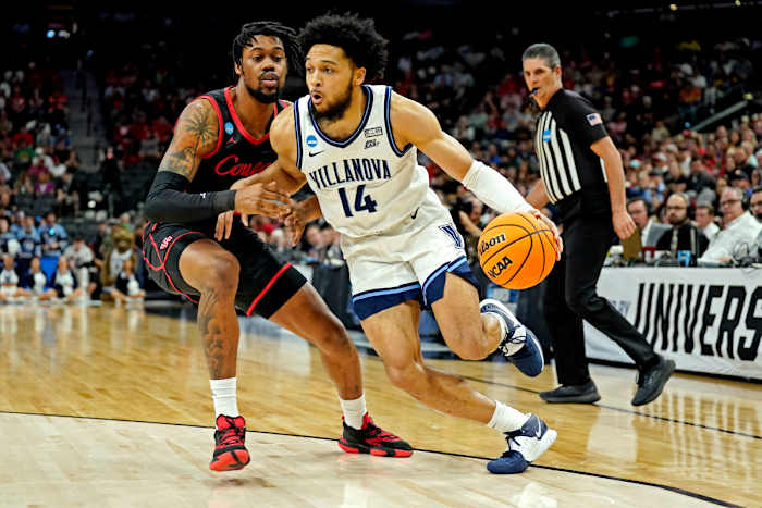 Mar 26, 2022; San Antonio, TX, USA; Villanova Wildcats guard Caleb Daniels (14) drives to the basket against Houston Cougars forward J'Wan Roberts (13) during the first half in the finals of the South regional of the men's college basketball NCAA Tournament at AT&T Center. Mandatory Credit: Scott Wachter-USA TODAY Sports